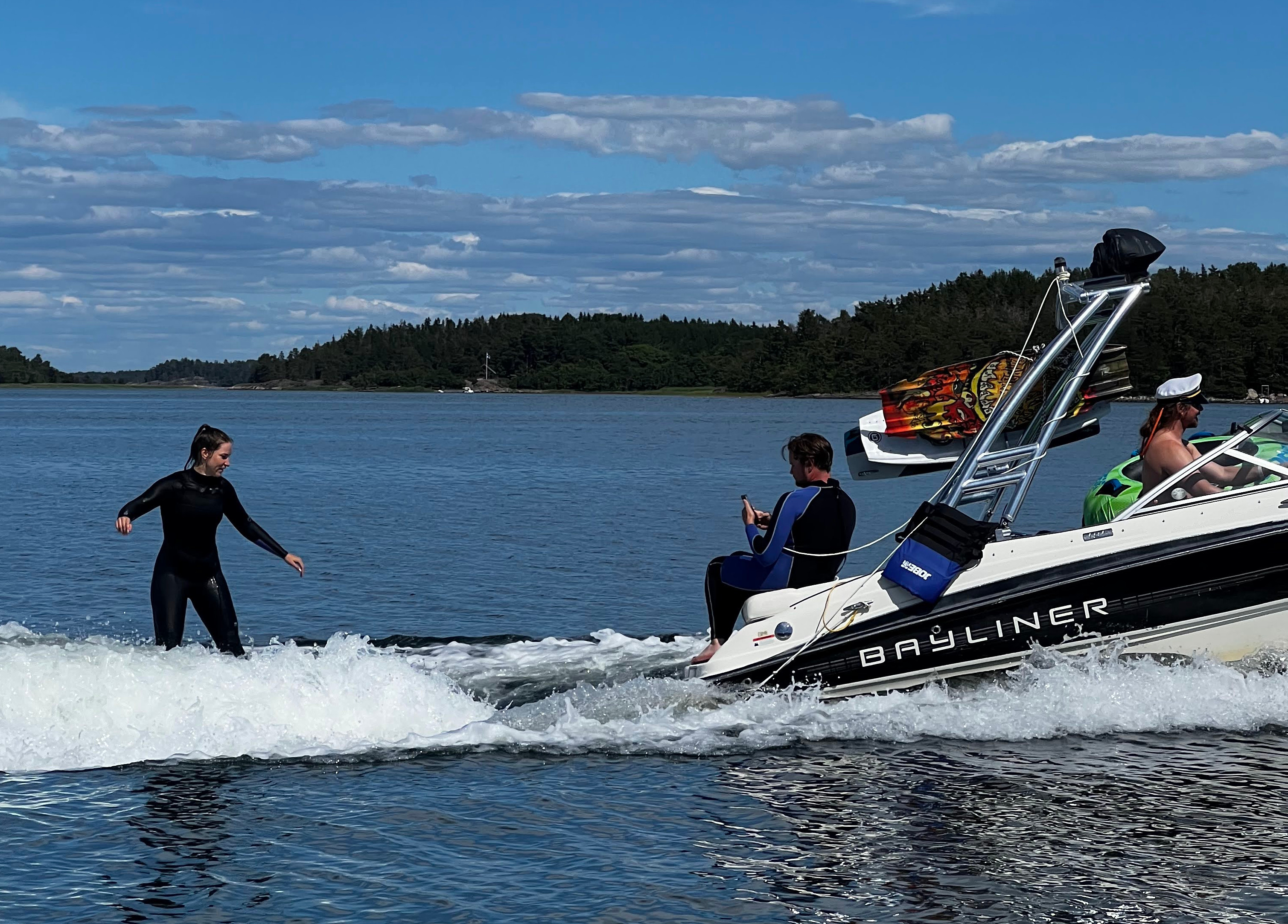 Wakesurfer and boat from the side